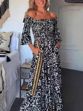 Laden Sie das Bild in den Galerie-Viewer, Off-The-Shoulder Smocked Stretch Black Printed Maxi Dress