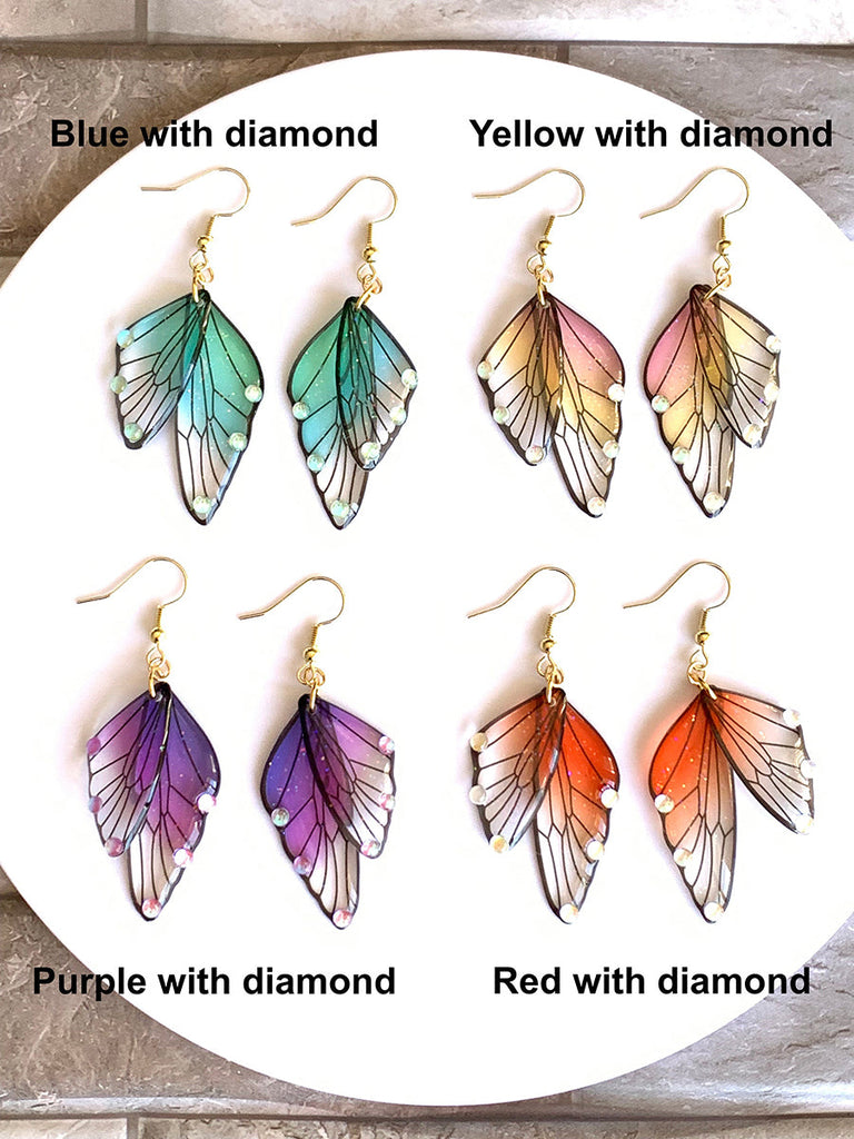 Boucles d'oreilles faites main en forme d'ailes de papillon 