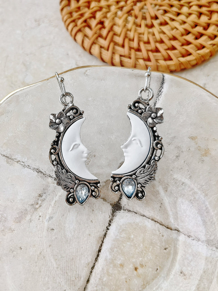 Boucle d'oreille pendentif topaze bleue avec motif croissant de lune