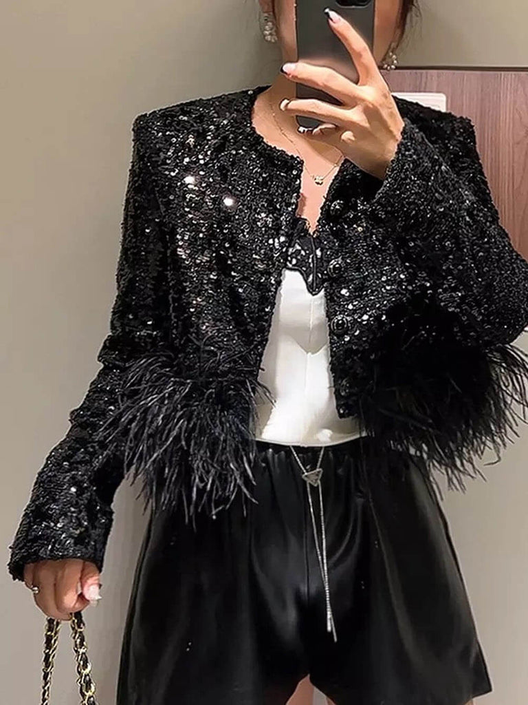 Veste à paillettes noires avec plumes