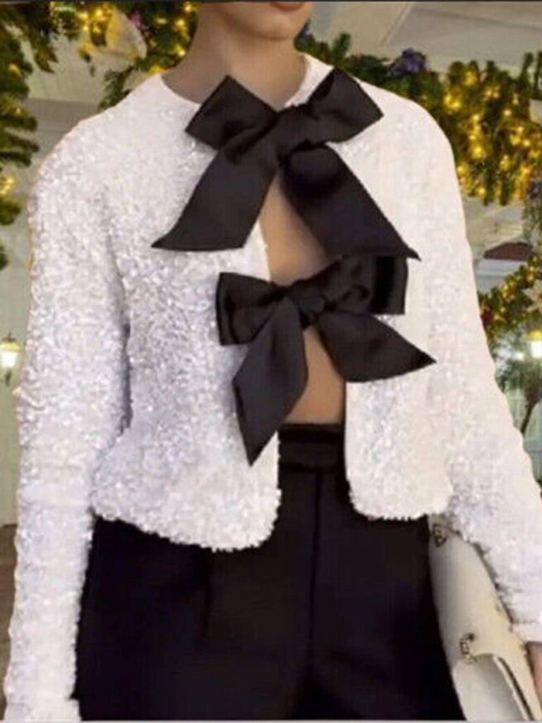 Veste à paillettes nouée sur le devant