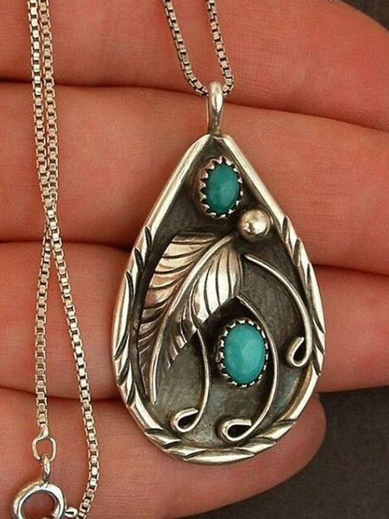 Collier avec pendentif en plumes turquoise