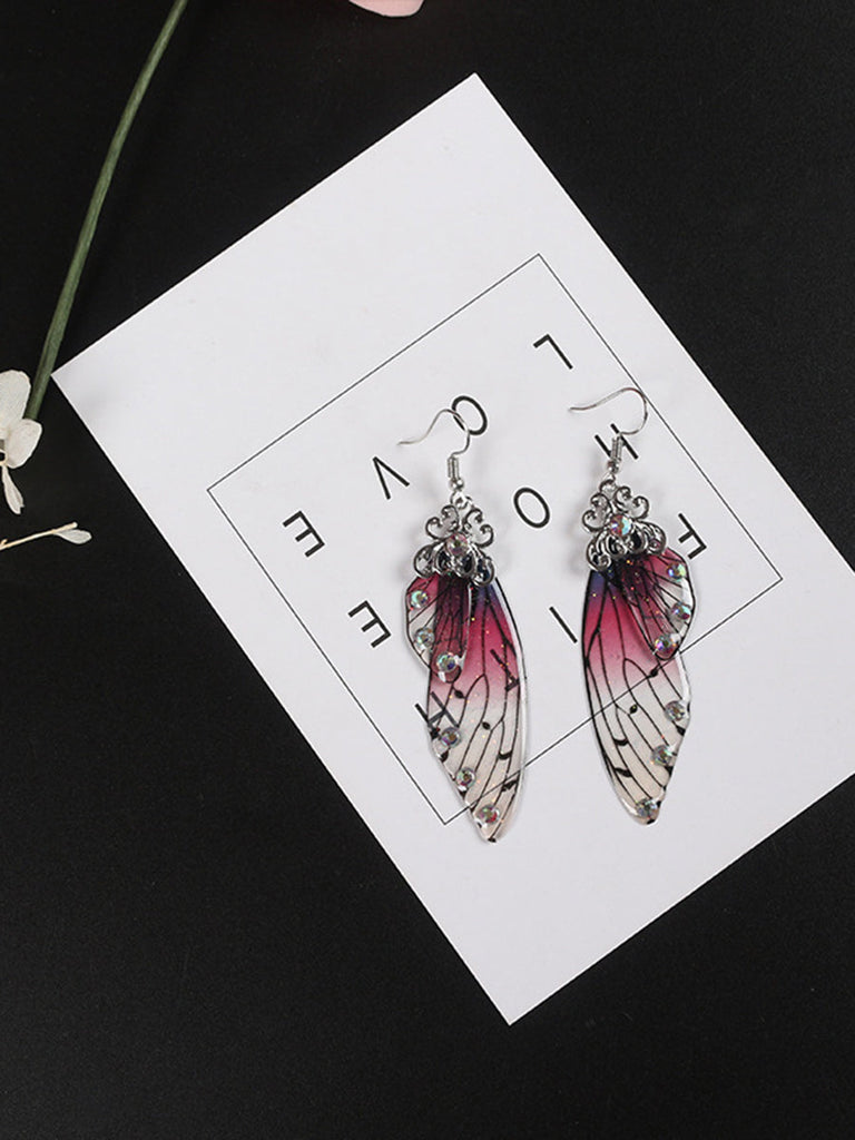 Boucles d'oreilles ailes de papillon en cristal violet avec strass et ailes de cigale