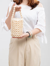 Load image into Gallery viewer, Hollowed-Out Wooden Bead Woven Bucket Bag