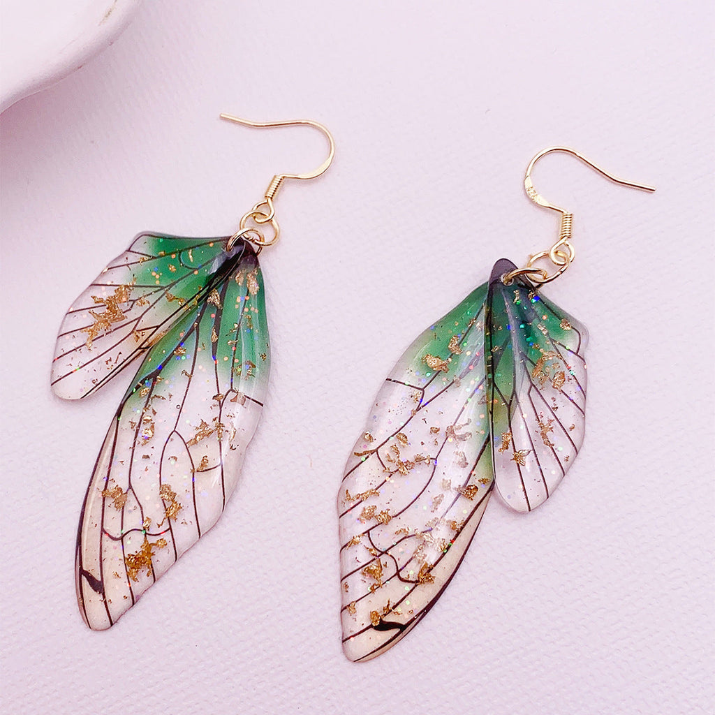 Boucles d'oreilles faites main en forme d'ailes de papillon 