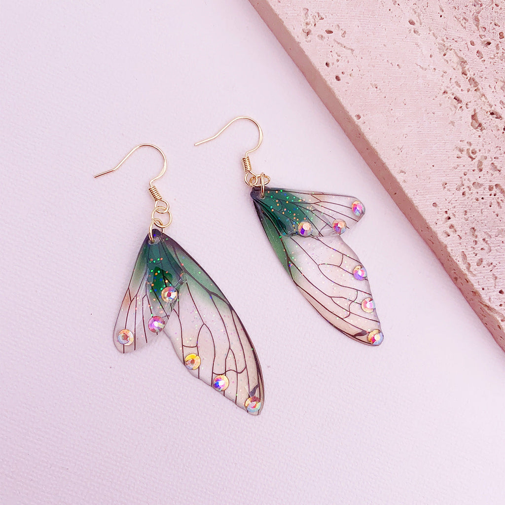 Boucles d'oreilles faites main en forme d'ailes de papillon 