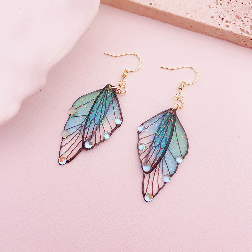 Boucles d'oreilles faites main en forme d'ailes de papillon 