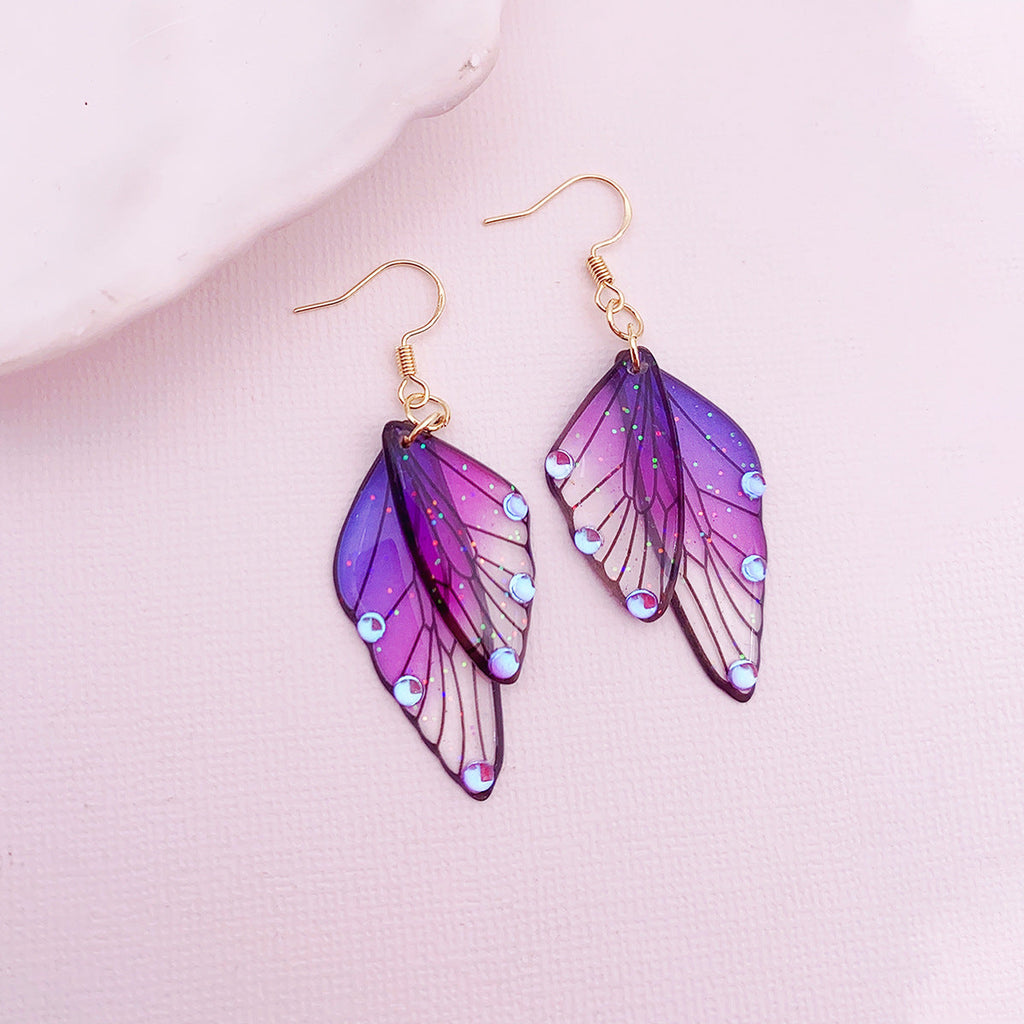 Boucles d'oreilles faites main en forme d'ailes de papillon 