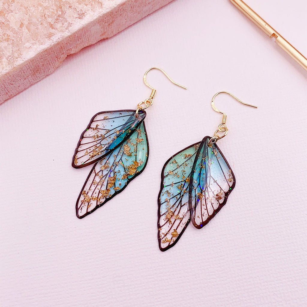 Boucles d'oreilles faites main en forme d'ailes de papillon 