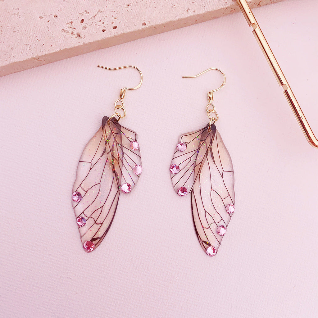 Boucles d'oreilles faites main en forme d'ailes de papillon 