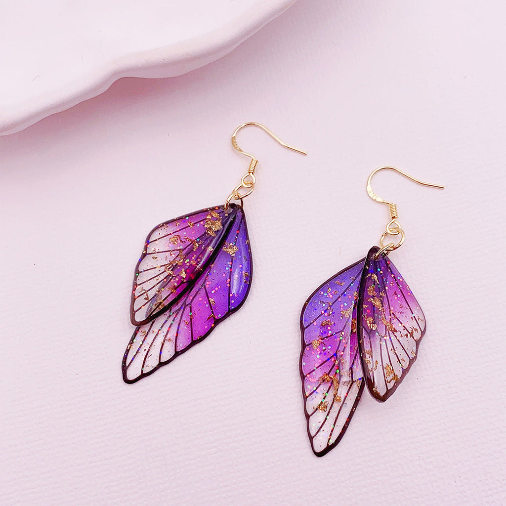 Boucles d'oreilles faites main en forme d'ailes de papillon 