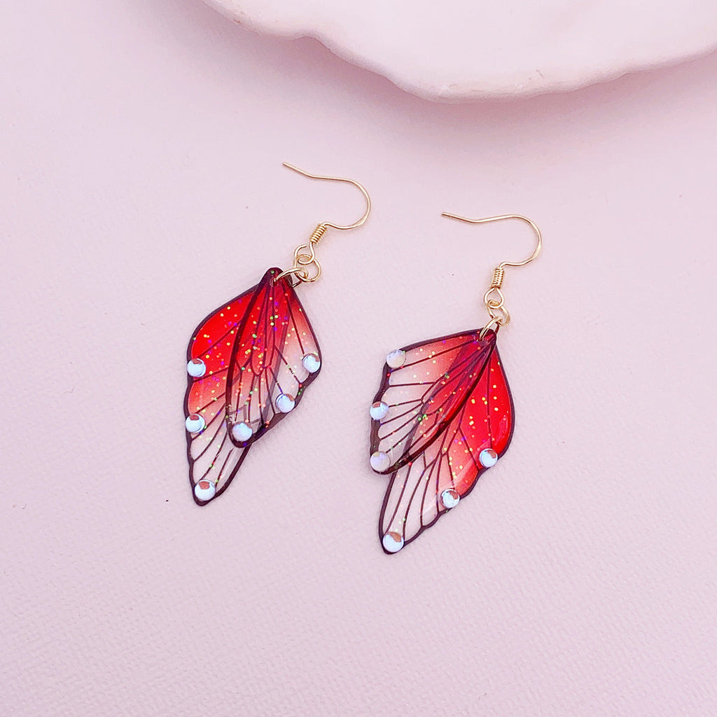 Boucles d'oreilles faites main en forme d'ailes de papillon 