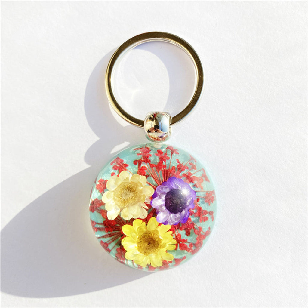 Porte-clés marguerite en fleurs séchées ambrées hémisphériques