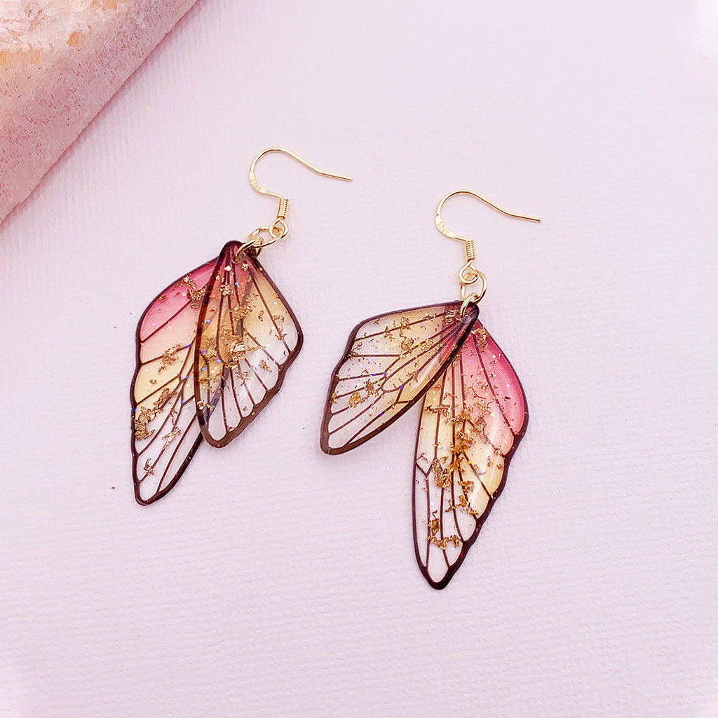 Boucles d'oreilles faites main en forme d'ailes de papillon 