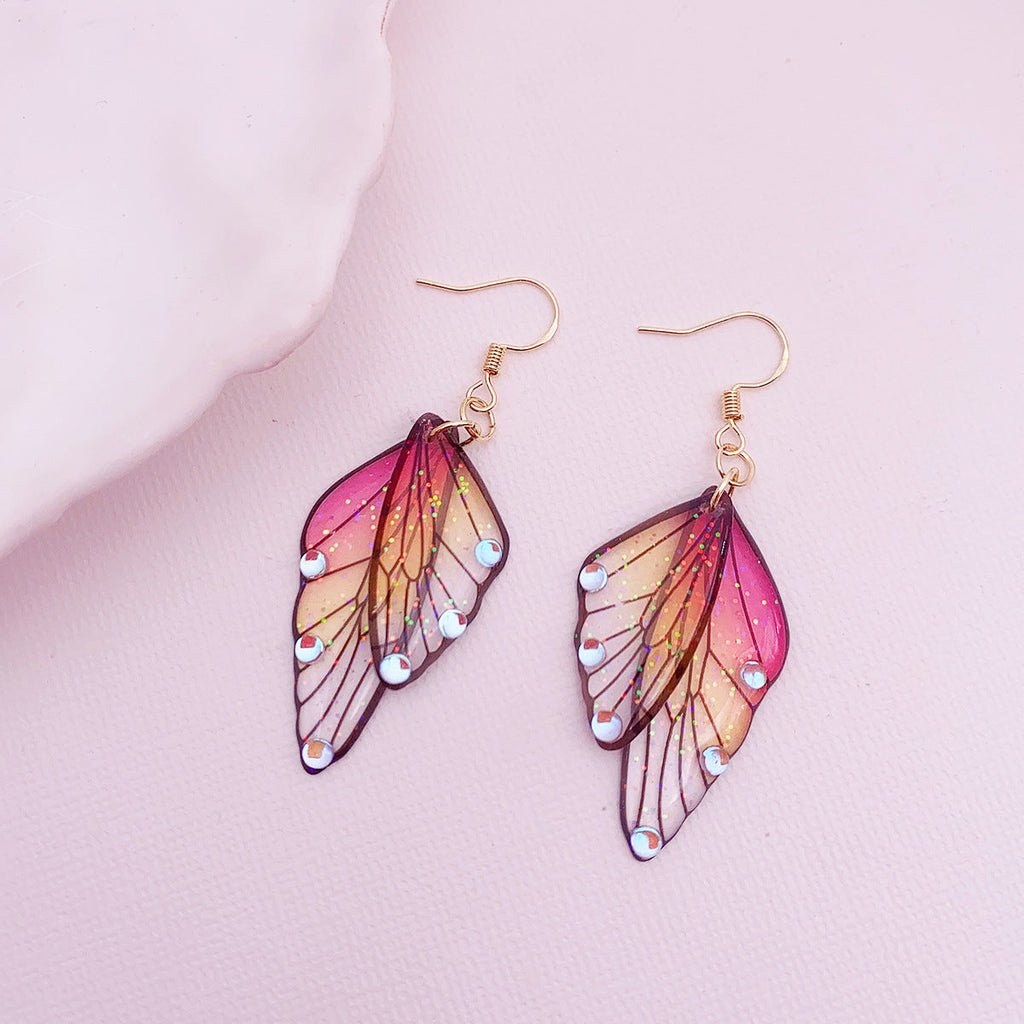 Boucles d'oreilles faites main en forme d'ailes de papillon 