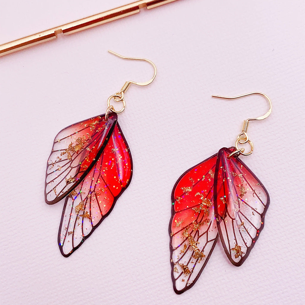 Boucles d'oreilles faites main en forme d'ailes de papillon 