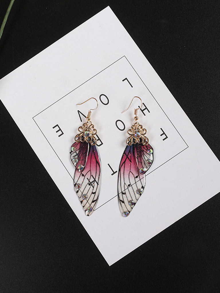 Boucles d'oreilles ailes de papillon en cristal violet avec strass et ailes de cigale